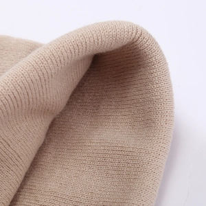 Beige knit beanie with mushroom embroidery detail, winter street style for men and women