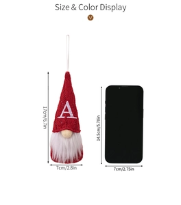 Size display of a red knitted Christmas gnome with letter A compared to a smartphone