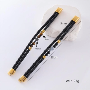 Detail view of double-strand leather bracelet with cross pendant and tiger eye beads