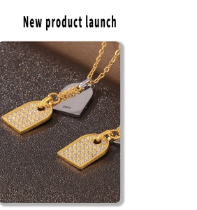 Macro shot of gold and silver rectangular pendants with cubic zirconia inlay details