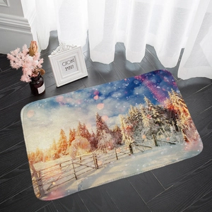 Absorbent flannel floor mat with a snowy winter forest scene on dark wood flooring
