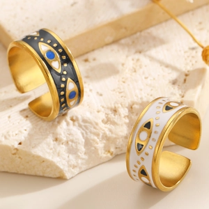Detail of adjustable evil eye rings with colorful enamel and gold-plated finish