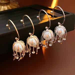 Elegant pearl tassel C-shape earrings with star charms in gold and silver finish