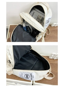 Detailed interior of a white large-capacity backpack with laptop compartment and wide opening