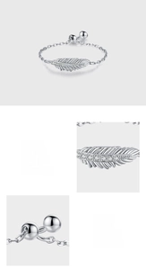 Detail of S925 sterling silver feather ring with adjustable chain and sparkling zircon