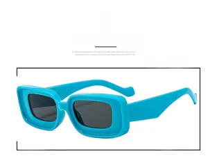 Detail shot of bright blue thick square frames and dark grey lenses for fashion sunglasses