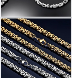 Detailed shot of silver and gold Byzantine chain necklaces with lobster clasps for men