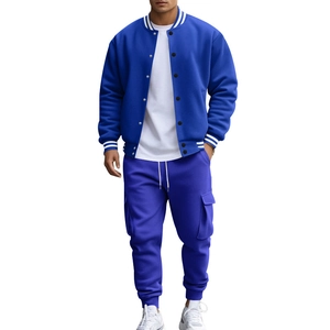 Detail of royal blue baseball collar jacket with ribbed cuffs and matching cargo pants