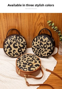 Detailed view of fashionable leopard print round bags in black, coffee, and brown colors