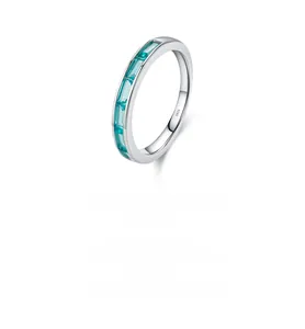 Detailed close-up of S925 sterling silver stamp and rectangular teal gemstones on ring