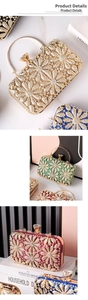 Detail of sparkling rhinestone evening clutch bags with floral pattern and metal handle