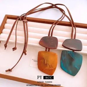 Vintage irregular geometric resin pendant necklace with marble texture on brown cord
