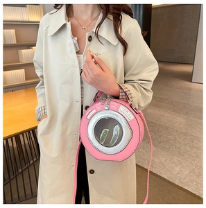 Unique pink washing machine style handbag with clear round window and metal detail