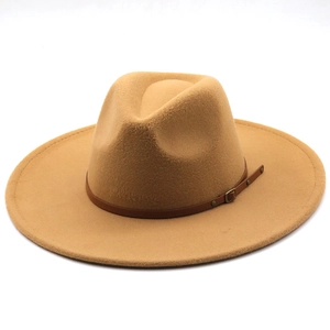 Detail of camel wool fedora with broad brim and brown leather band with golden buckle