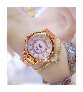 Rose gold flower-shaped women's watch with crystal-encrusted dial on model wrist