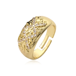 Irregular geometric gold-plated open ring with sparkling crystal stones on white background