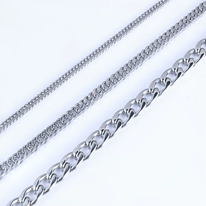 Detailed view comparing three different widths of high-polish silver Cuban link chains
