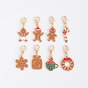 Set of 8 gold Christmas enamel pendants featuring gingerbread man and candy cane