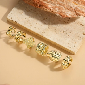 Set of six 14K gold plated open rings featuring star and woven texture designs