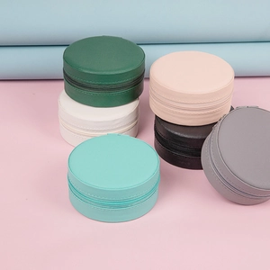 Portable round PU leather jewelry travel case in multiple colors with zipper closure