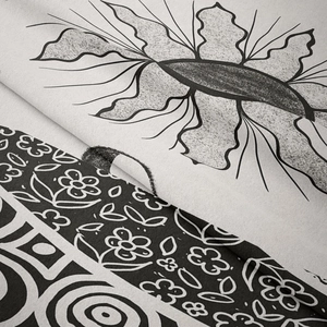 Nordic wall tapestry with cactus and butterfly prints in black and white woven fabric