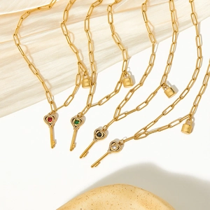 Golden heart key pendant necklace with multi-color gems and crystal accents