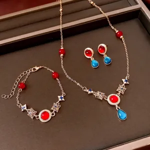 Vintage gold jewelry set with red stones and blue resin waterdrop pendants for women