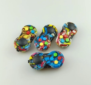 Set of four colorful graffiti pattern fidget controllers with joysticks and buttons