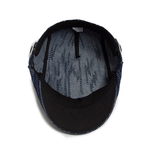 Inner view of navy denim flat cap with premium cotton texture and breathable lining
