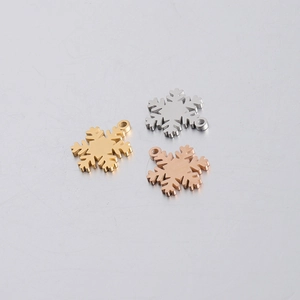 Polished snowflake charms in gold, silver, and rose gold for DIY jewelry making crafts
