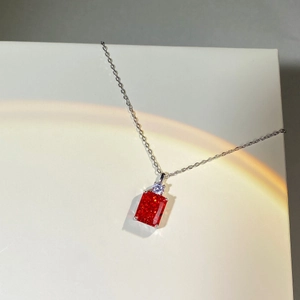 Detailed view of 925 sterling silver necklace with red rectangular gemstone pendant