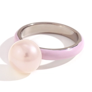 Minimalist stainless steel ring featuring a large pink pearl and pink enamel drip finish