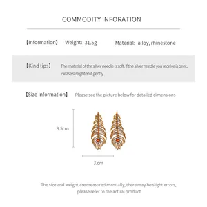 Size chart showing vintage feather earrings with dimensions 8.5cm by 3.0cm and 31.5g weight