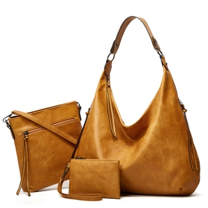 Detailed view of the 3-piece brown PU leather tote bag set including crossbody and clutch