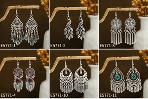 Close-up of vintage ethnic bohemian earrings set in antique silver with colorful beads