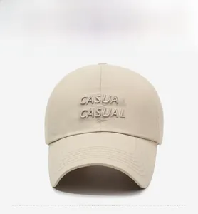 Close-up of beige quick-dry baseball cap with CASUAL embroidery and breathable eyelets