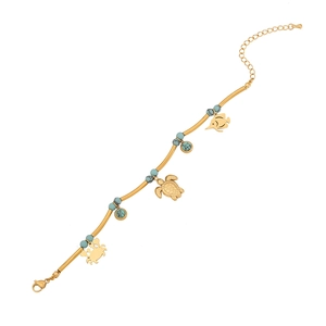 Golden ocean charm bracelet with sea turtle, crab, fish pendants and blue turquoise beads