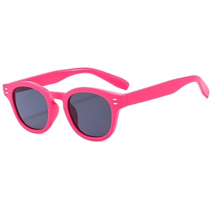 Retro bright pink round frame sunglasses with grey lenses and silver metal rivets