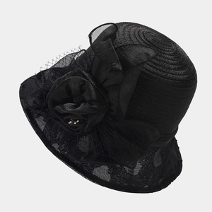 Detailed close-up of the black organza sun hat featuring lace mesh and a large floral accent