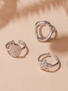 Detailed view of silver-toned zircon star rings with minimalist geometric open design