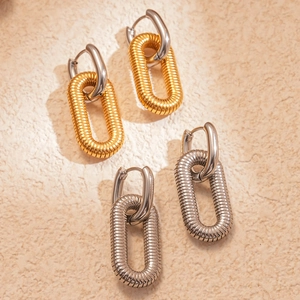 18k gold and silver plated minimalist textured link hoop earrings on sandy stone surface