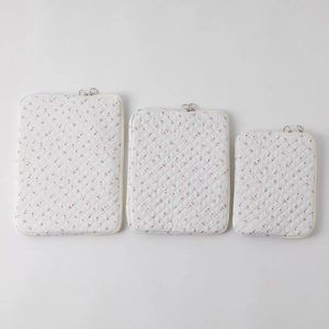 Three-piece set of quilted cotton laptop bags with cherry print in multiple sizes