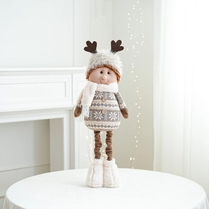 Detail of Christmas plush doll with reindeer antlers, knitted outfit and long standing legs