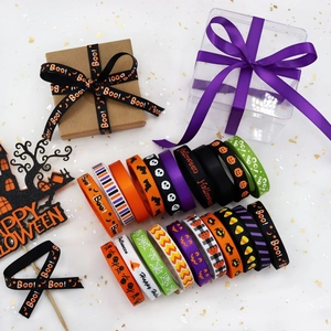 Detail of 10mm Halloween ribbons with pumpkin, skull, and ghost prints for DIY decor