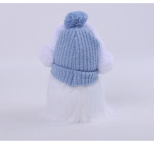 Back view of a plush ornament featuring a blue knit hat and fluffy white faux fur texture