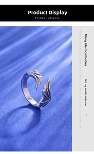 Detailed view of vintage silver devil wing ring with textured gothic craftsmanship