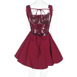 Detail of wine red backless dress featuring elegant criss-cross lace-up straps and a bow tie