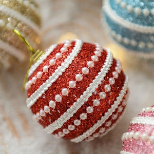 Red Christmas ball ornament with glitter and pearl beads for festive tree decoration