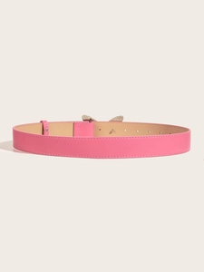 Detail of pink slim leather belt with a minimalist silver metal buckle for women