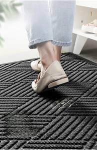 Detail of polypropylene door mat with non-slip diagonal texture and dust removal surface